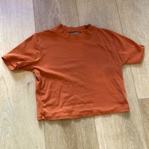 Burt orange cropped t shirt. Plain on front and back.